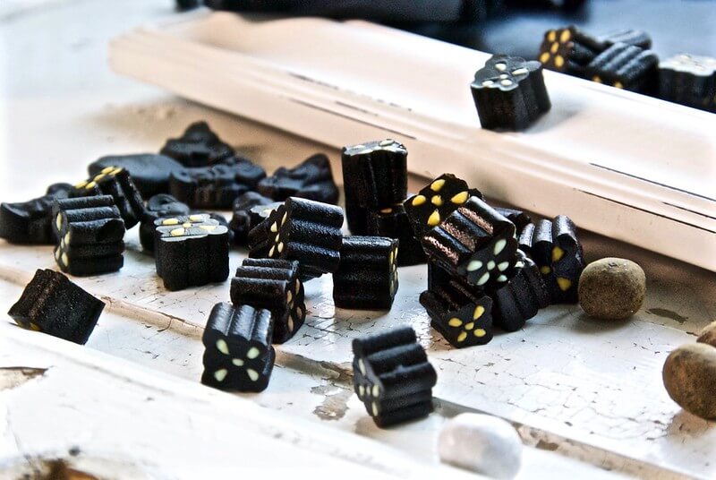 A photo of liquorice candy | The Best 5 Traditional Dishes in Denmark | Amitylux Tours | Scandinavian Guided Tours | VIP & Luxury Experiences in the Nordics