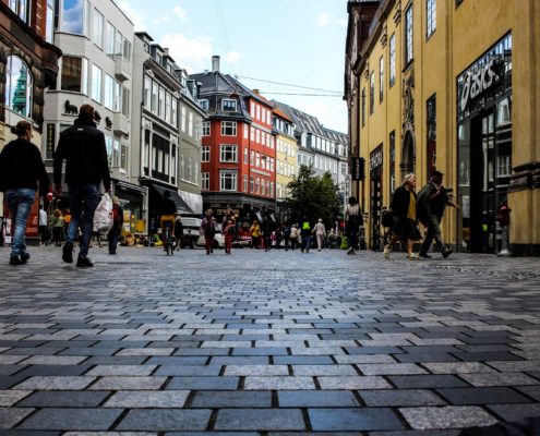 A photo of a square with people walking in Copenhagen, Denmark | Copenhagen Small Walking Tour | 3 Hours | Amitylux Tours | Guided Tours | VIP & Luxury Experiences