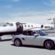 A private jet and a luxury car parked at the airport | Private Jet Luxury Services | Fly With Us | Amitylux Tours | Scandinavian Guided Tours | VIP & Luxury Experiences in the Nordics