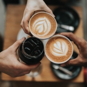 A photo of three cups of coffee being held by people | The Best 4 Tips For Visiting Copenhagen In Autumn | Amitylux Tours | Guided City Tours | VIP & Luxury Experiences
