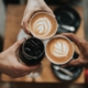 A photo of three cups of coffee being held by people | The Best 4 Tips For Visiting Copenhagen In Autumn | Amitylux Tours | Scandinavian Guided Tours | VIP & Luxury Experiences in the Nordics