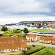 A photo of Kronborg Castles showing its grassy areas near the shore | The Best 5 Day Trips From Copenhagen | Amitylux Tours | Scandinavian Guided Tours | VIP & Luxury Experiences in the Nordics