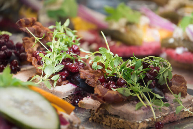 A photo of an open face sandwich | The Best 5 Traditional Dishes in Denmark | Amitylux Tours | Scandinavian Guided Tours | VIP & Luxury Experiences in the Nordics