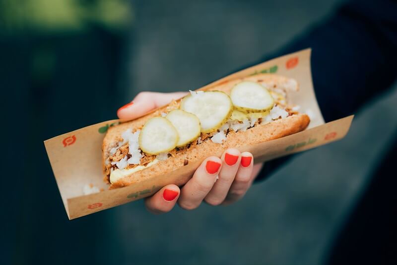 A photo of a hot dog style sandwich | The Best 5 Traditional Dishes in Denmark | Amitylux Tours | Scandinavian Guided Tours | VIP & Luxury Experiences in the Nordics