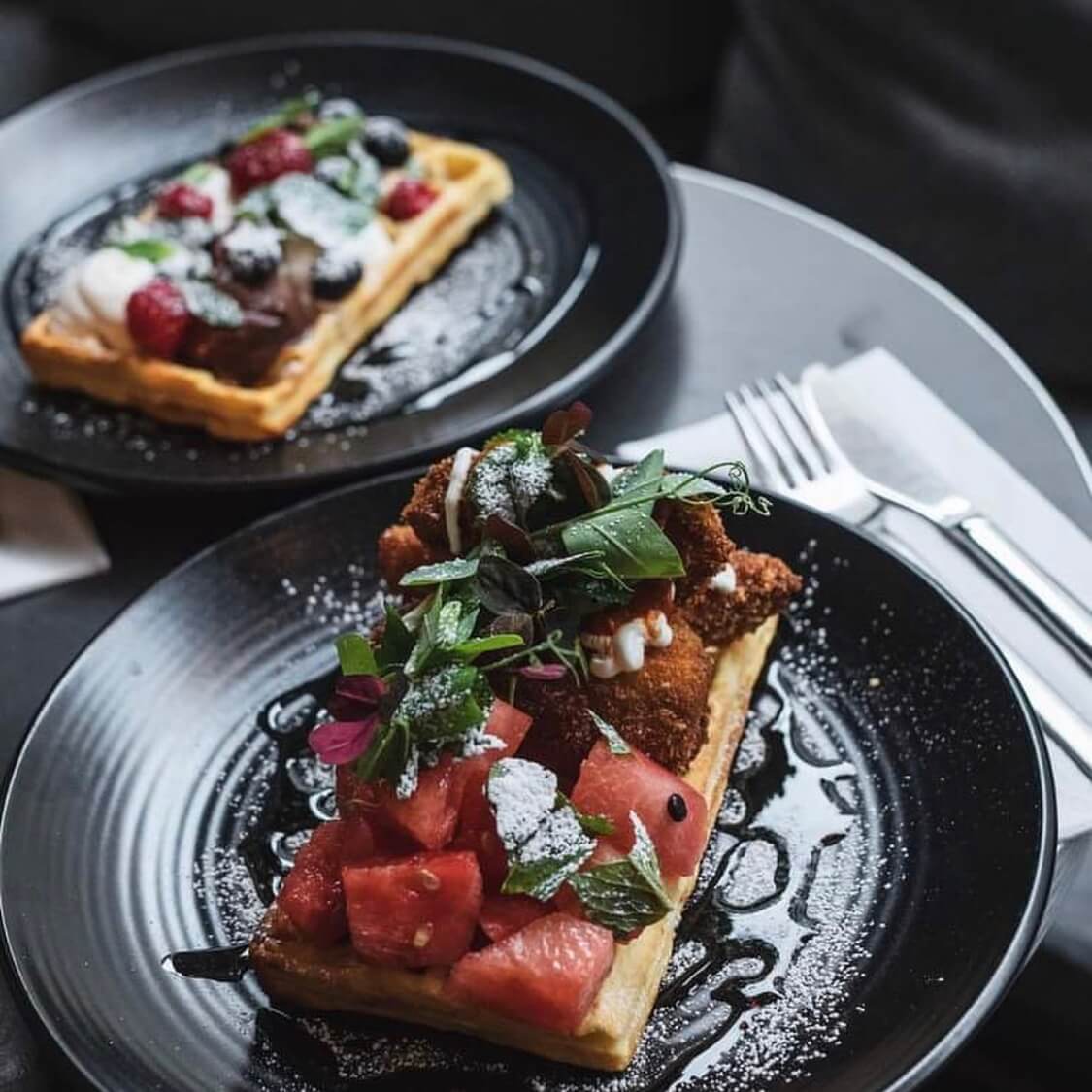 A photo of two plates of a light meal at the Union Kitchen | The Best Breakfast Places in Copenhagen | Amitylux Tours | Scandinavian Guided Tours | VIP & Luxury Experiences in the Nordics