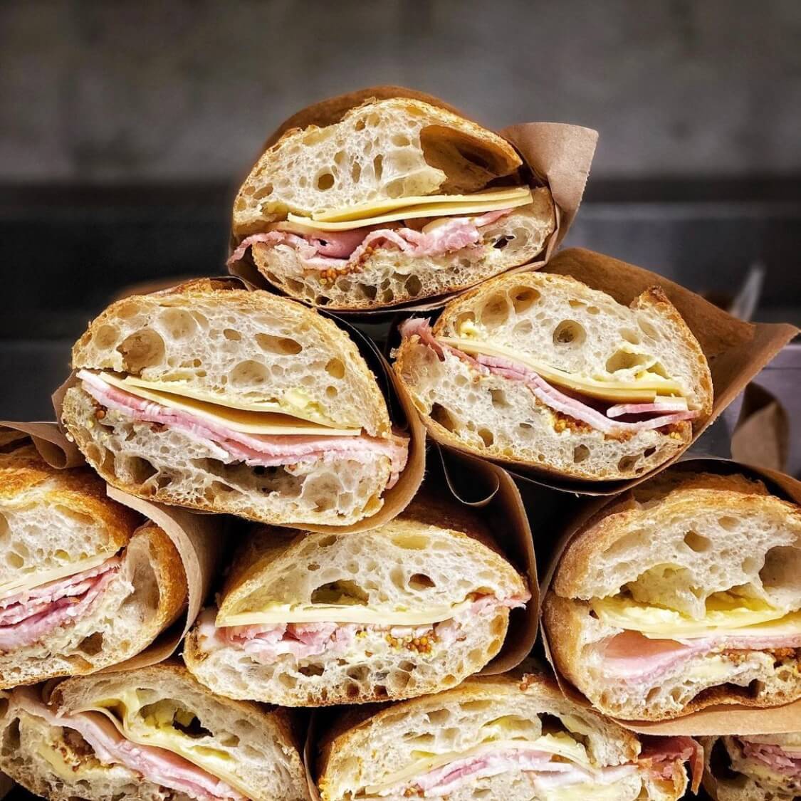 A photo of multiple ham and cheese sandwich in baguettes at Hart Bageri | The Best Breakfast Places in Copenhagen | Amitylux Tours | Scandinavian Guided Tours | VIP & Luxury Experiences in the Nordics