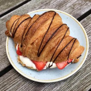 A photo of a chocolate croissant at Kaf | The Best Breakfast Places in Copenhagen | Amitylux Tours | Guided Tours | VIP & Luxury Experiences