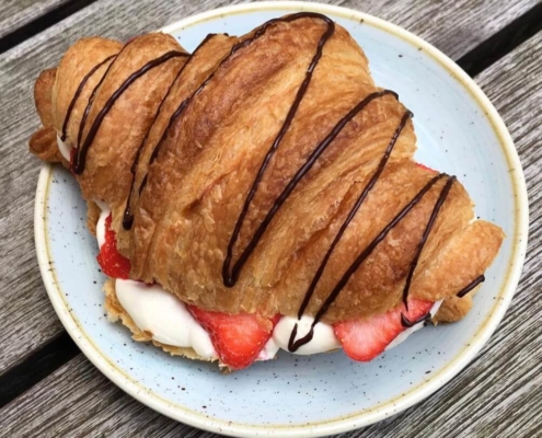 A photo of a chocolate croissant at Kaf | The Best Breakfast Places in Copenhagen | Amitylux Tours | Guided Tours | VIP & Luxury Experiences