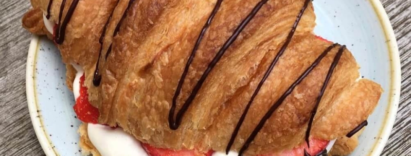 A photo of a chocolate croissant at Kaf | The Best Breakfast Places in Copenhagen | Amitylux Tours | Scandinavian Guided Tours | VIP & Luxury Experiences in the Nordics