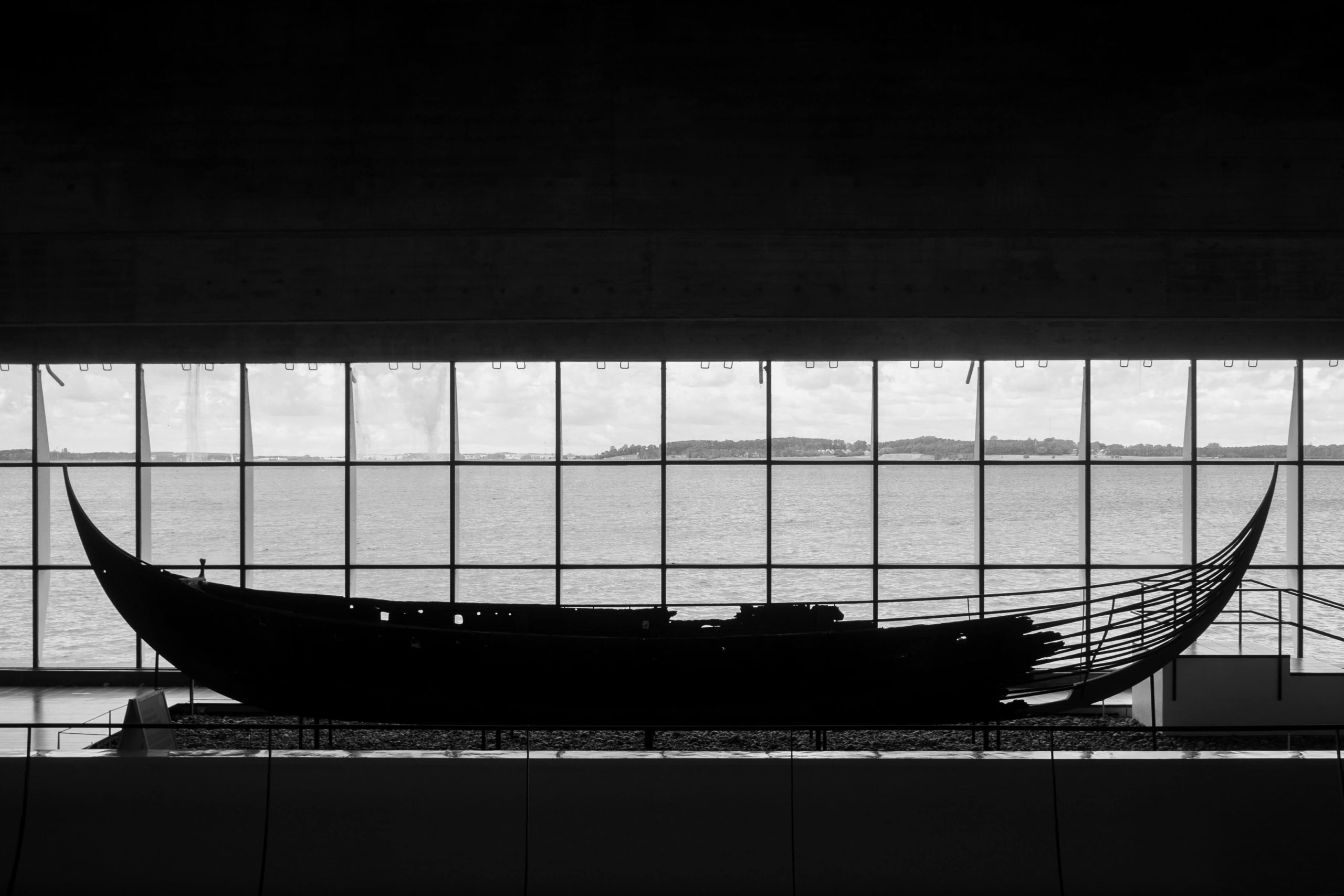 A photo of a Viking ship located inside the Viking Ship Museum | The Best 5 Museums in Denmark | Amitylux Tours | Scandinavian Guided Tours | VIP & Luxury Experiences in the Nordics