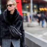 A blonde woman posing outdoors in a Scandinavian street | Scandinavian Fashion: The Amazing And Unique Style | Amitylux Tours | Scandinavian Guided Tours | VIP & Luxury Experiences in the Nordics