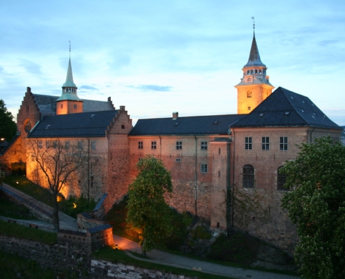 A photo of Akershus Castle in Oslo at dusk | Unique Custom Tours: The Magic of Nordic Countries | Amitylux Tours | Guided City Tours | VIP & Luxury Experiences