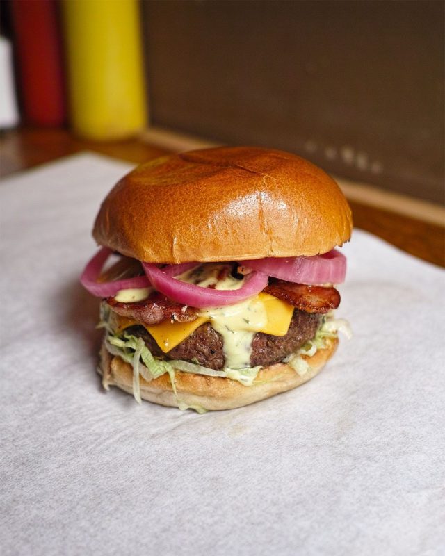 A photo of a burger from Tommi’s Burger Joint | The Best Burgers in Copenhagen: Our Top 6 Favorite Spots | Amitylux Tours | Scandinavian Guided Tours | VIP & Luxury Experiences in the Nordics