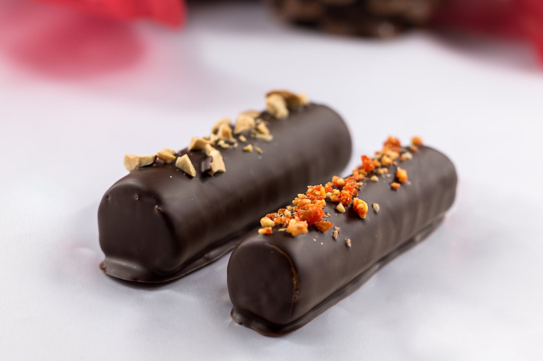 A photo of two chocolate sticks from Alida Marstrand Chokolade | The Best 5 Chocolatiers in Copenhagen | Amitylux Tours | Scandinavian Guided Tours | VIP & Luxury Experiences in the Nordics