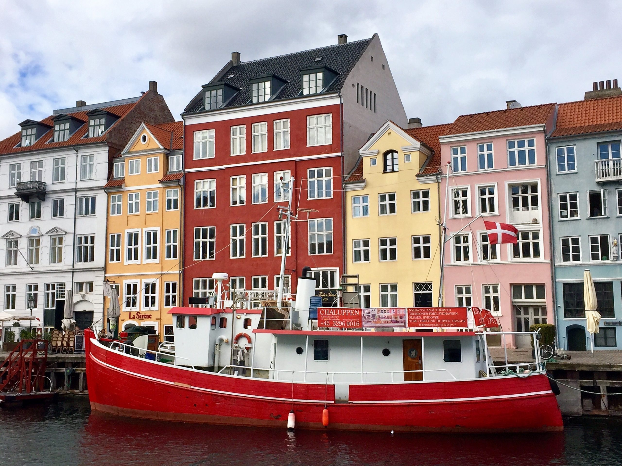 A photo of Nyhavn Harbour, Denmark | The World's Happiest Countries: Tribute to Magic Scandinavia | Amitylux Tours | Scandinavian Guided Tours | VIP & Luxury Experiences in the Nordics