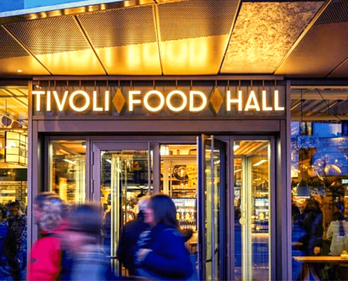 A photo of the entrance of Tivoli Food Hall | The Best 5 Street Food Markets in Copenhagen | Amitylux Tours | Scandinavian Guided Tours | VIP & Luxury Experiences in the Nordics