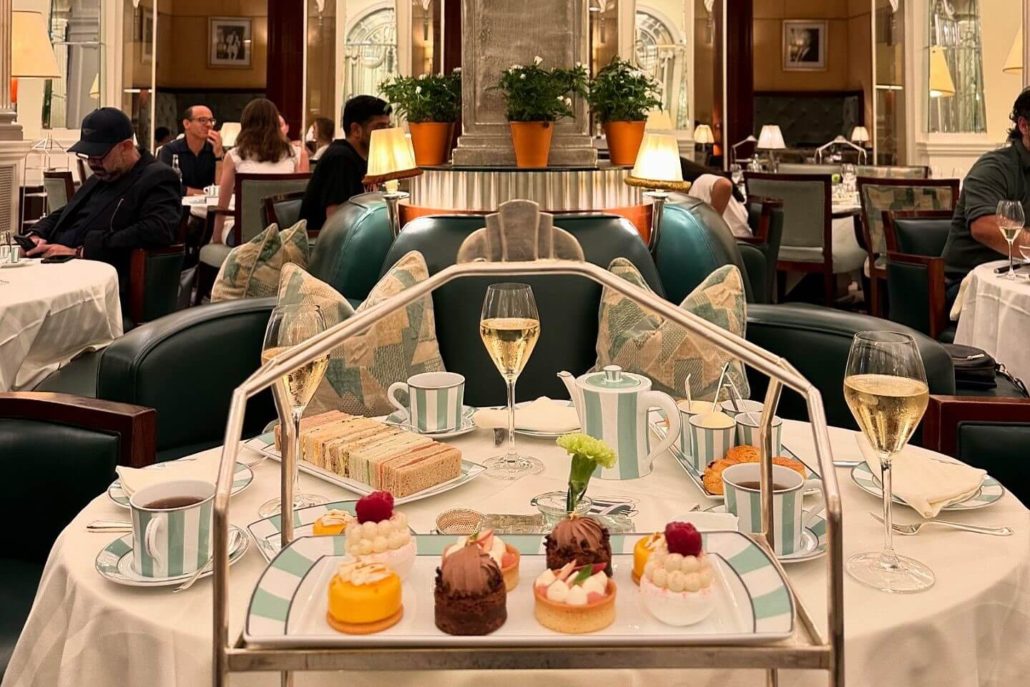 Tea in London. The best sports for tea in London in the summertime. Photo by CLARIDGE’S on August 12, 2024. An image of a restaurant set for the afternoon tea at the Claridge's Hotel. 