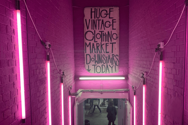 pink neon lights and entrance of Brick Lane Vintage Market