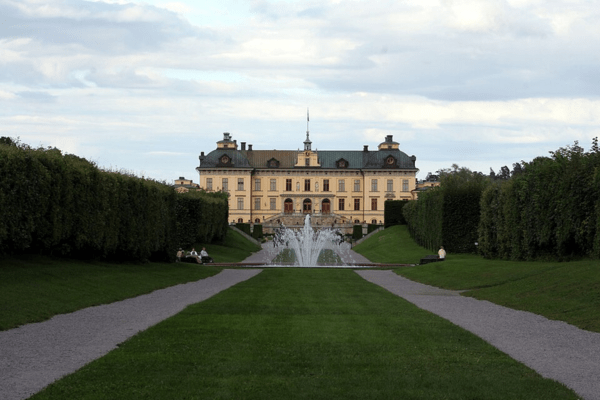 Drottningholm Palace exterior and garden with a fountain