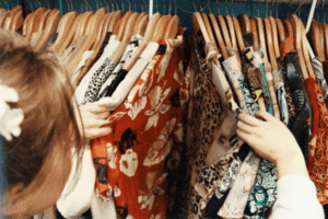female thrift shopping colorful shirts