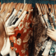 female thrift shopping colorful shirts