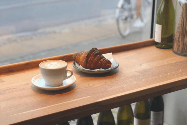 a coffee and a croissant