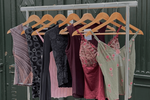 a rack of vintage tops